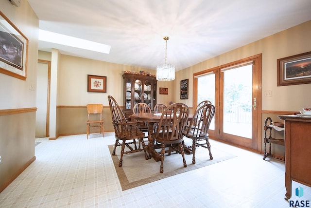 429 S Elm St, Lennox, SD 57039 - dining space featuring a skylight, a chandelier, and light carpet