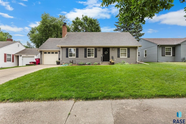 2424 S Main Ave, Sioux Falls, SD 57105 - view of front of home with an attached garage, driveway, a chimney, and a front lawn