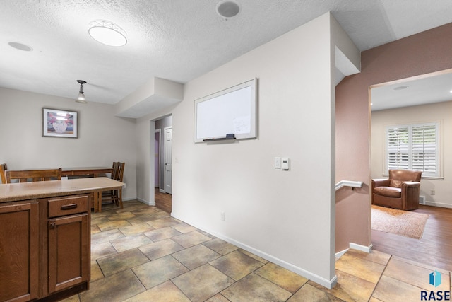 2424 S Main Ave, Sioux Falls, SD 57105 - kitchen featuring light countertops and a textured ceiling