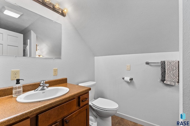 2424 S Main Ave, Sioux Falls, SD 57105 - bathroom with vanity, tile patterned floors, and lofted ceiling