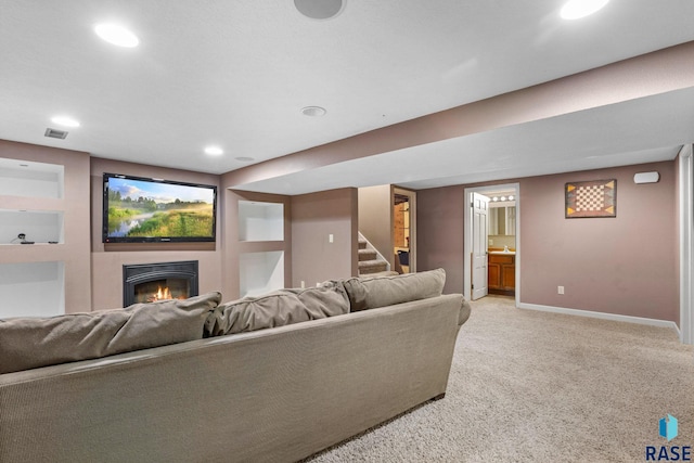 2424 S Main Ave, Sioux Falls, SD 57105 - living area featuring stairway, light carpet, recessed lighting, and a glass covered fireplace