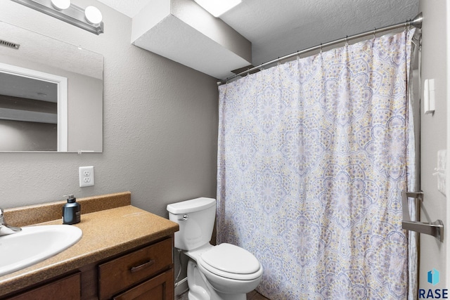 2424 S Main Ave, Sioux Falls, SD 57105 - full bathroom featuring vanity, a shower with curtain, and a textured wall