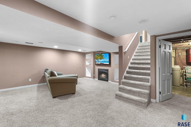 2424 S Main Ave, Sioux Falls, SD 57105 - carpeted living room with a warm lit fireplace, stairs, and recessed lighting