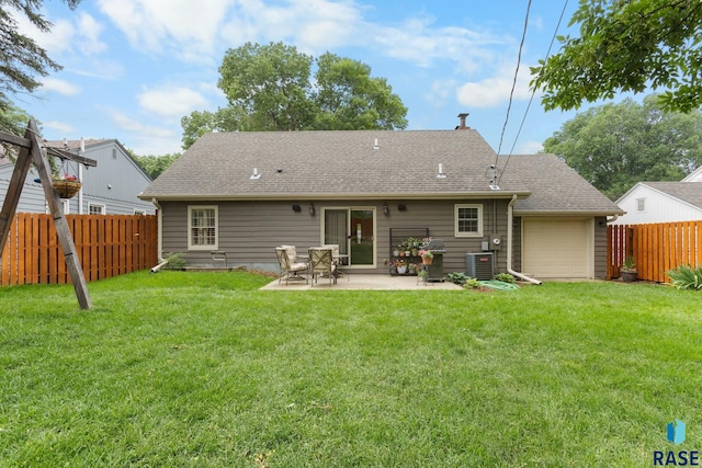 2424 S Main Ave, Sioux Falls, SD 57105 - back of house featuring an attached garage, a patio, and a shingled roof