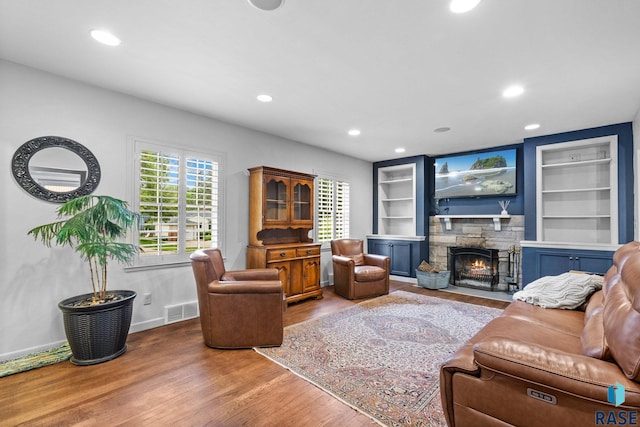 2424 S Main Ave, Sioux Falls, SD 57105 - living area featuring wood finished floors, healthy amount of natural light, recessed lighting, and built in features