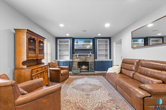 2424 S Main Ave, Sioux Falls, SD 57105 - living area featuring recessed lighting, a stone fireplace, built in shelves, and wood finished floors