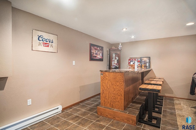 300 W 3rd St, Tea, SD 57064 - indoor dry bar with a baseboard radiator, recessed lighting, and dark tile patterned flooring