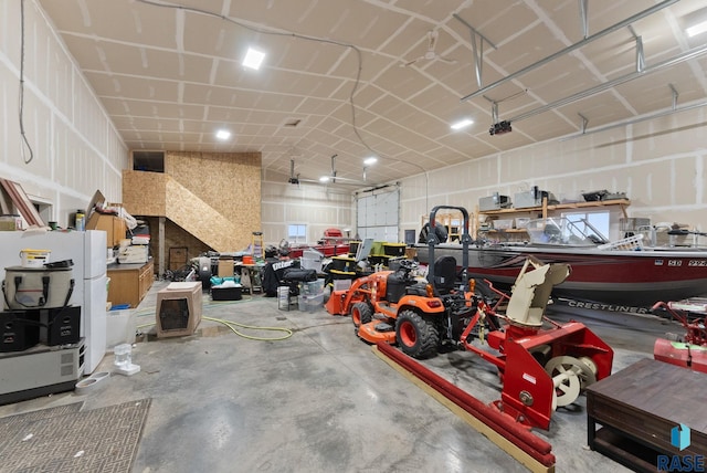 25953 481st Ave, Brandon, SD 57005 - garage featuring freestanding refrigerator and a garage door opener