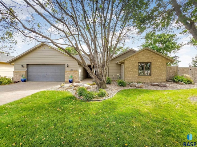 4808 S Shields Ave, Sioux Falls, SD 57103 - ranch-style house with brick siding, driveway, and a garage