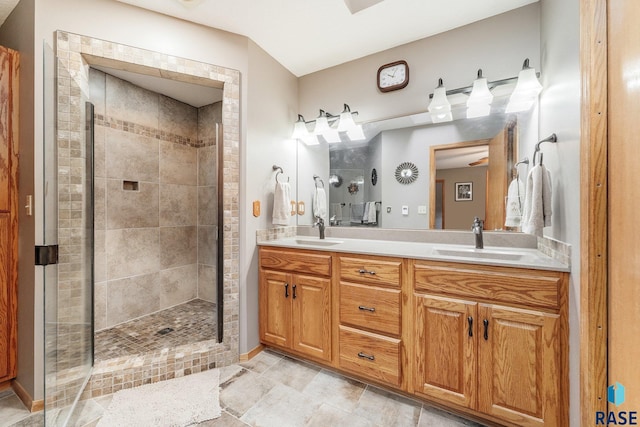 4808 S Shields Ave, Sioux Falls, SD 57103 - full bathroom with tiled shower, double vanity, and tile patterned floors