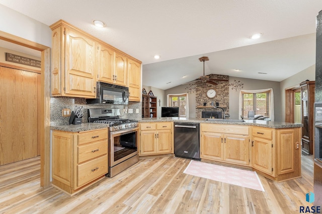 4808 S Shields Ave, Sioux Falls, SD 57103 - kitchen featuring black appliances, lofted ceiling, light wood-style flooring, ceiling fan, and light brown cabinetry