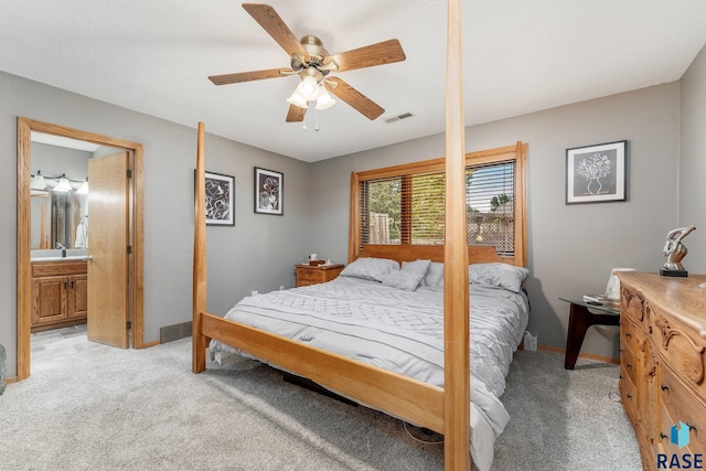 4808 S Shields Ave, Sioux Falls, SD 57103 - bedroom featuring light colored carpet, a ceiling fan, and ensuite bath