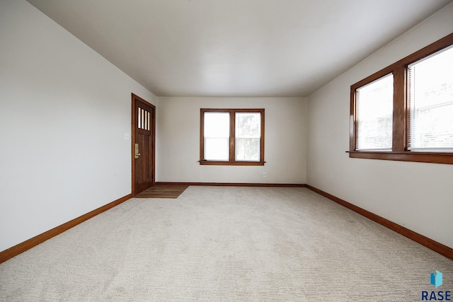 1330 W 14th St, Sioux Falls, SD 57104 - empty room with plenty of natural light and light carpet