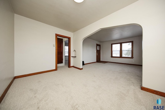 1330 W 14th St, Sioux Falls, SD 57104 - unfurnished room with arched walkways and light carpet