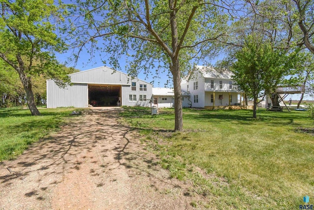 47138 293rd St, Beresford, SD 57004 - view of front of property with driveway, a detached garage, a front lawn, and a pole building