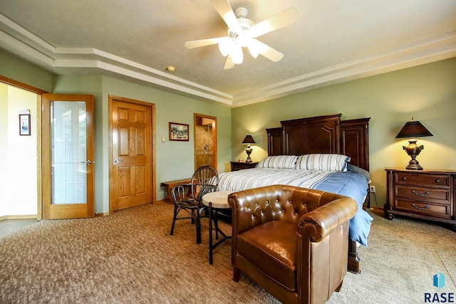6811 E Split Rock Cir, Sioux Falls, SD 57110 - bedroom with light carpet, a raised ceiling, and ceiling fan