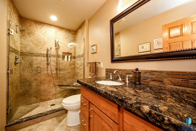 6811 E Split Rock Cir, Sioux Falls, SD 57110 - bathroom featuring vanity, a stall shower, tile patterned flooring, and recessed lighting