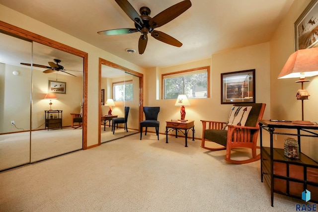 6811 E Split Rock Cir, Sioux Falls, SD 57110 - living area featuring a ceiling fan and carpet