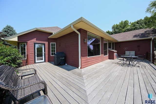 6811 E Split Rock Cir, Sioux Falls, SD 57110 - wooden deck featuring outdoor dining area and grilling area