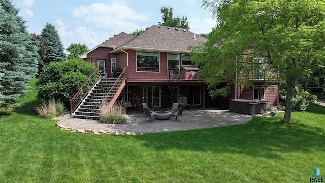 6811 E Split Rock Cir, Sioux Falls, SD 57110 - back of house featuring a patio, stairway, a yard, an outdoor fire pit, and a wooden deck