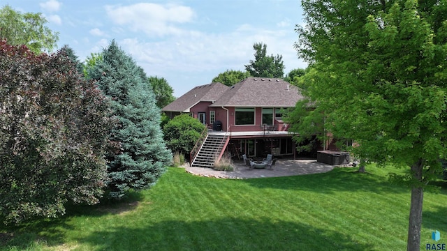 6811 E Split Rock Cir, Sioux Falls, SD 57110 - rear view of property featuring stairway, a patio area, a yard, a deck, and roof with shingles