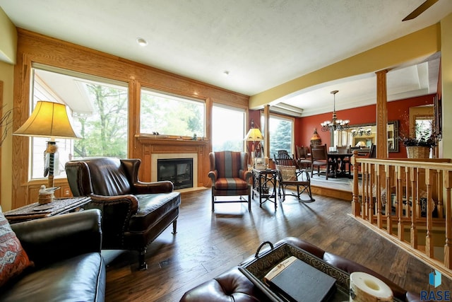 6811 E Split Rock Cir, Sioux Falls, SD 57110 - living area featuring a chandelier, wood-type flooring, and a glass covered fireplace
