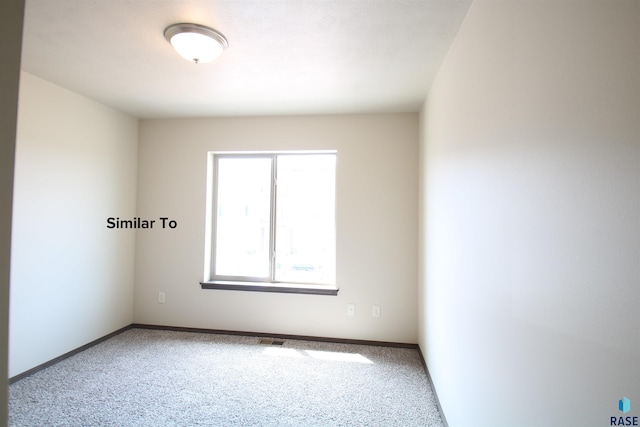 7713 S Townsley Ave Unit 4, Sioux Falls, SD 57108 - carpeted empty room featuring baseboards