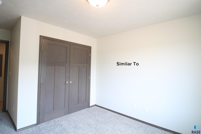 7713 S Townsley Ave Unit 4, Sioux Falls, SD 57108 - unfurnished bedroom featuring carpet and a closet