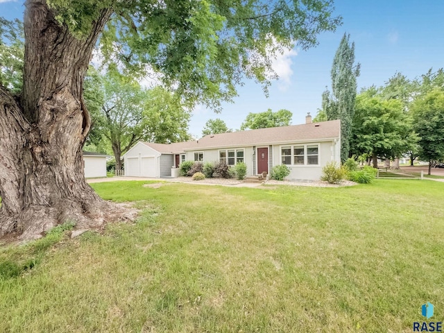 2109 W 37th St, Sioux Falls, SD 57105 - ranch-style house featuring a chimney, a front lawn, an attached garage, and driveway