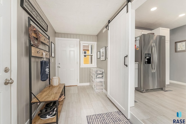 2109 W 37th St, Sioux Falls, SD 57105 - mudroom featuring a barn door and recessed lighting