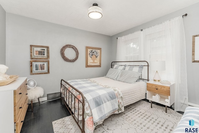 2109 W 37th St, Sioux Falls, SD 57105 - bedroom with baseboards and light wood-style floors