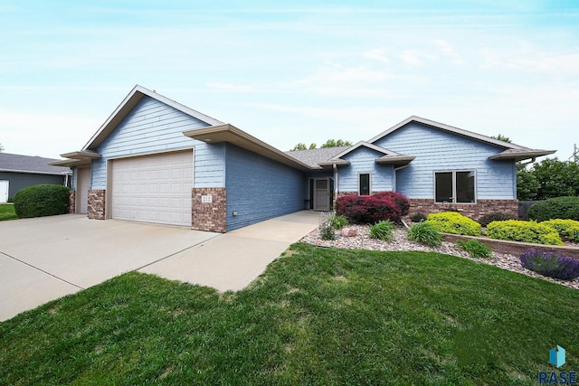 212 S Augusta Ave, Brandon, SD 57005 - single story home featuring brick siding, a garage, concrete driveway, and a front lawn