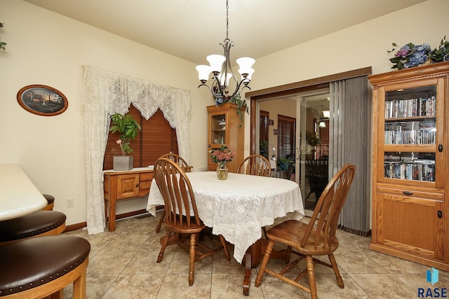 212 S Augusta Ave, Brandon, SD 57005 - dining area featuring a chandelier and light tile patterned floors