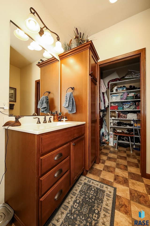 212 S Augusta Ave, Brandon, SD 57005 - bathroom with vanity and a spacious closet
