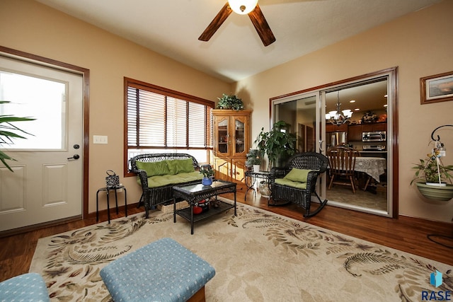 212 S Augusta Ave, Brandon, SD 57005 - living room featuring ceiling fan, a chandelier, and wood finished floors