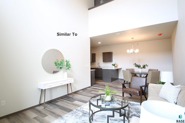 7713 S Townsley Ave Unit 5, Sioux Falls, SD 57108 - living room with light wood finished floors and a chandelier