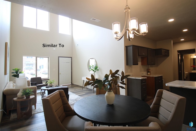 7713 S Townsley Ave Unit 5, Sioux Falls, SD 57108 - dining area featuring wood finished floors, a chandelier, and recessed lighting