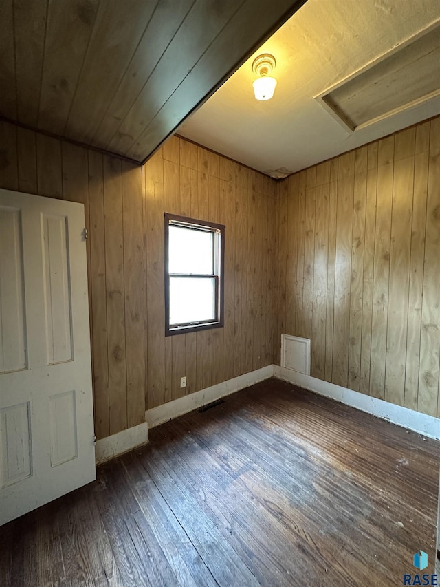 613 N Cedar St, Luverne, MN 56156 - unfurnished room featuring dark wood-type flooring and attic access