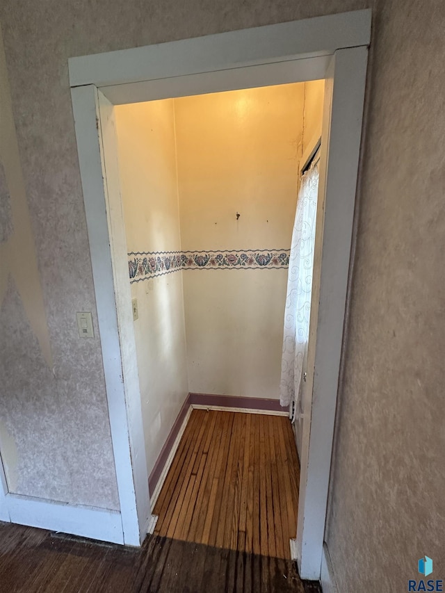 613 N Cedar St, Luverne, MN 56156 - hallway with hardwood / wood-style flooring