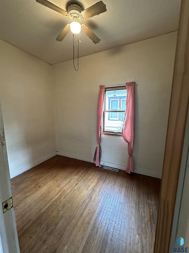 613 N Cedar St, Luverne, MN 56156 - unfurnished room with wood finished floors and a ceiling fan