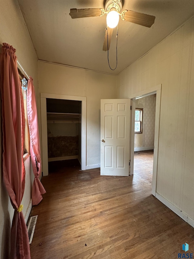 613 N Cedar St, Luverne, MN 56156 - unfurnished bedroom featuring wood finished floors and a ceiling fan