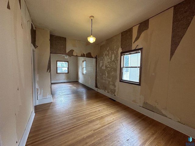 613 N Cedar St, Luverne, MN 56156 - unfurnished dining area with wood finished floors and baseboards