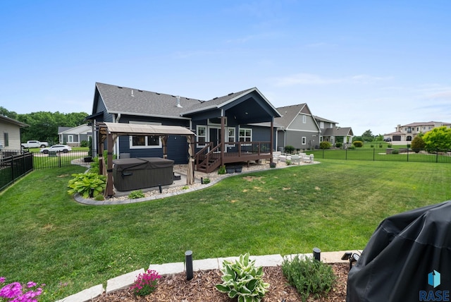 920 S Torrey Pine Ln, Sioux Falls, SD 57110 - rear view of property with a hot tub, a deck, a fenced backyard, a shingled roof, and a residential view