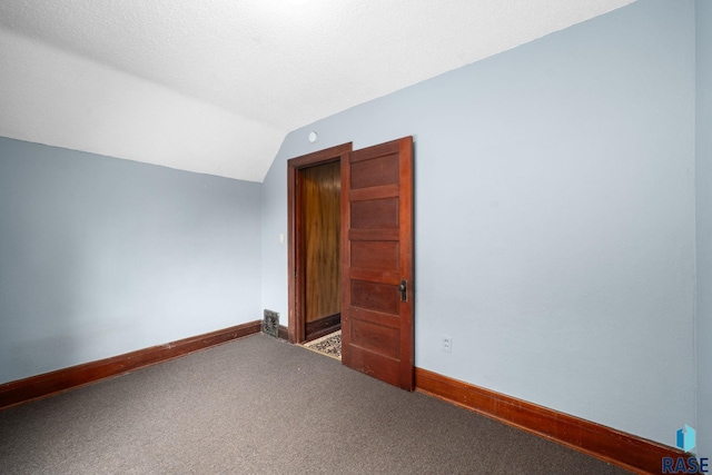 300 S Ash St, Lennox, SD 57039 - additional living space with carpet flooring and lofted ceiling