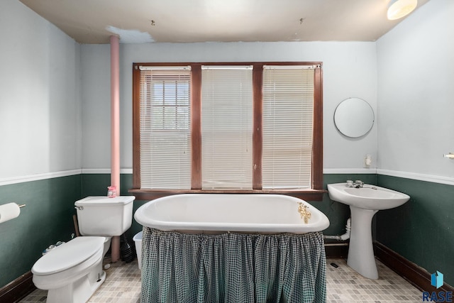 300 S Ash St, Lennox, SD 57039 - full bath featuring a freestanding bath and tile patterned flooring