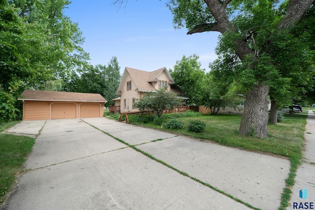 300 S Ash St, Lennox, SD 57039 - view of front of home featuring a garage and an outbuilding