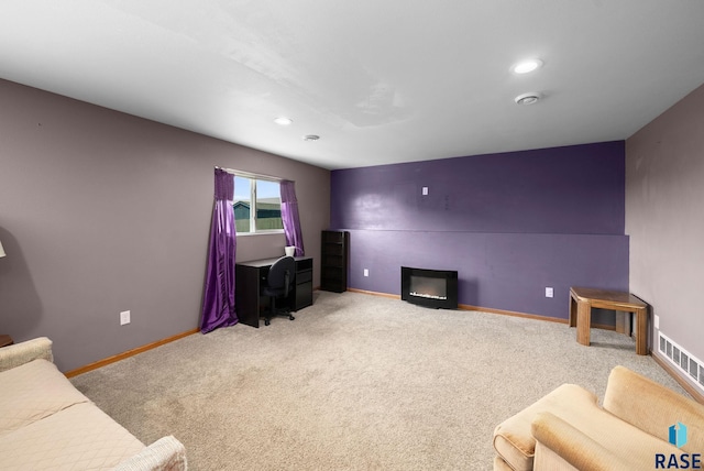 301 N Jenny Ave, Tea, SD 57064 - carpeted living area with a glass covered fireplace and recessed lighting