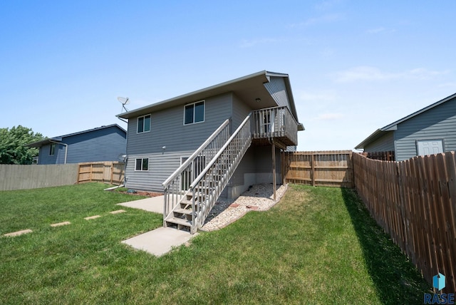 301 N Jenny Ave, Tea, SD 57064 - back of property with a fenced backyard, stairs, and a wooden deck