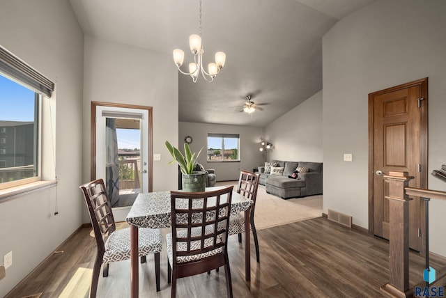 301 N Jenny Ave, Tea, SD 57064 - dining space with lofted ceiling, dark wood-style flooring, a ceiling fan, and a chandelier