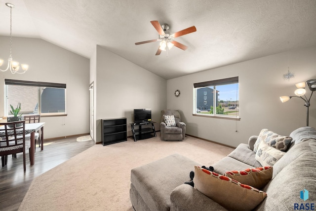 301 N Jenny Ave, Tea, SD 57064 - living area featuring a chandelier, vaulted ceiling, a ceiling fan, and wood finished floors